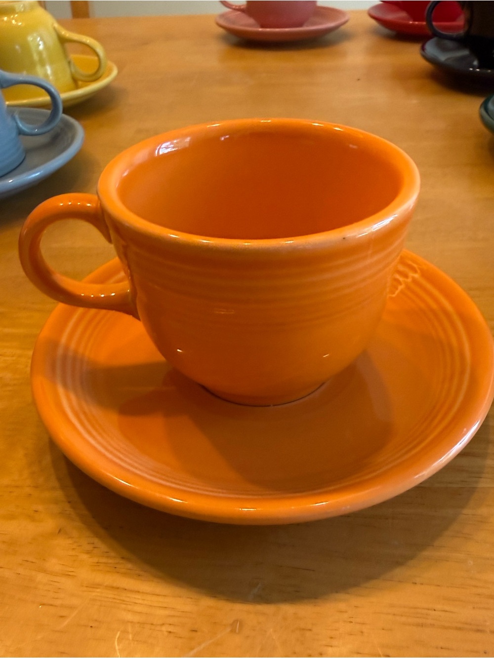 Fiestaware coffee cup and saucer tangerine orange by Homer Laughlin USA